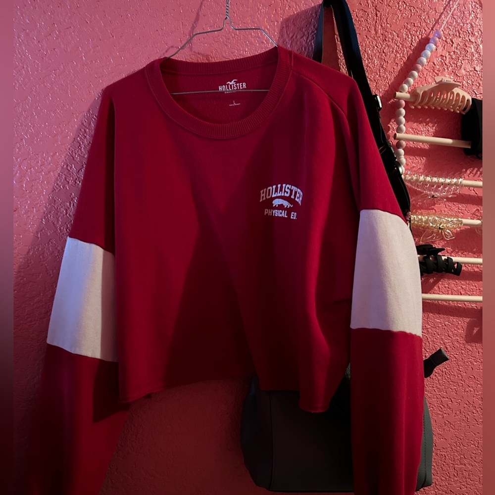 A red and white Hollister cropped sweater